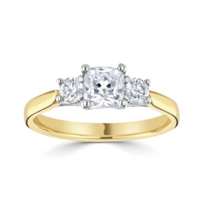 Three stone, Cushion cut centre stone with two RBC Diamonds either side, on a tapering band