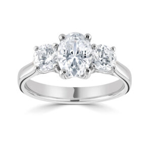 Three stone Centre Oval Diamond with Two RBC Diamonds either side